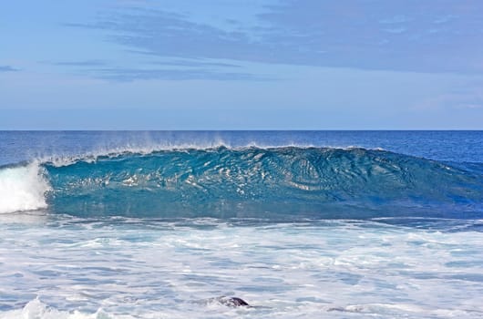 Cresting Wave on the tropical ocean by Espanola Island in the Galapagos