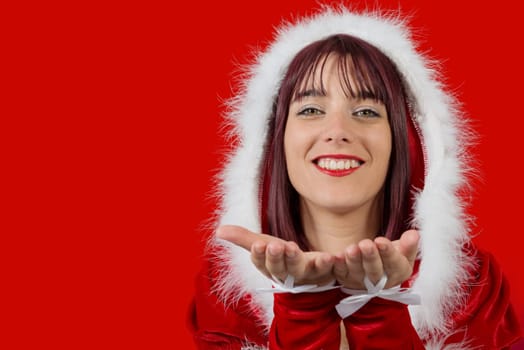 a portrait of beautiful  girl wearing santa claus clothes