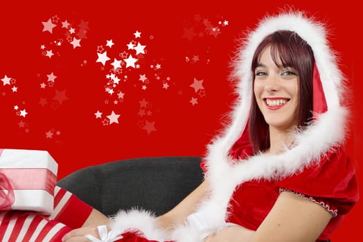beautiful sexy girl wearing santa claus clothes sitting on armchair