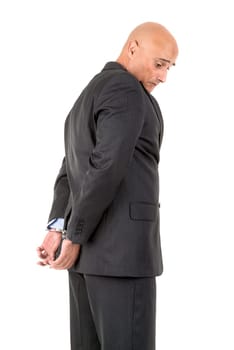 Businessman in handcuffs isolated in white background