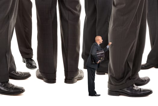 Small businessman trying to reach big business players