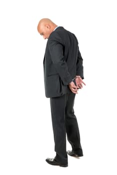 Businessman in handcuffs isolated in white background