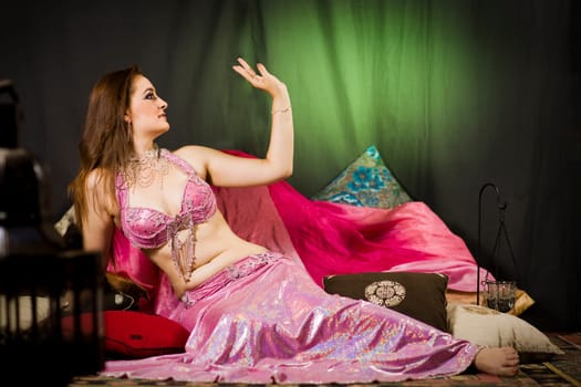 beautiful woman dancing the oriental style dance called belly dance