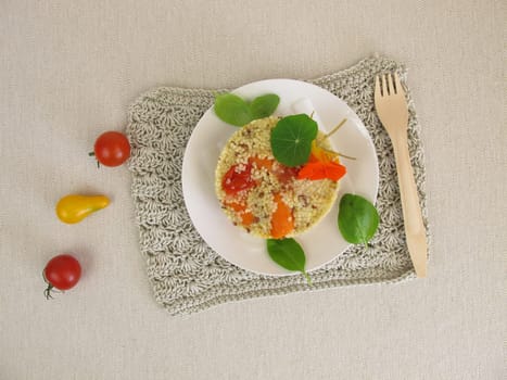 Millet turret with tomatoes,carrots and herbs