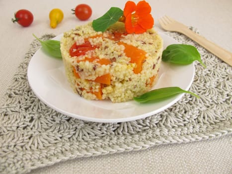Millet turret with tomatoes,carrots and herbs