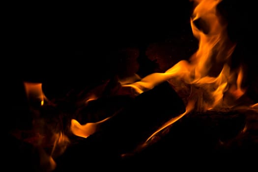 Fire flames on a black background. Blaze fire flame texture background. Close up of fire flames isolated on black background. Burn. Abstract fire flames background. Texture.