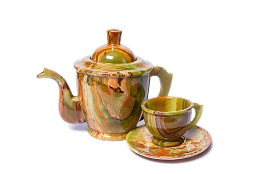 Teapots and cups made of natural onyx isolated on white background.