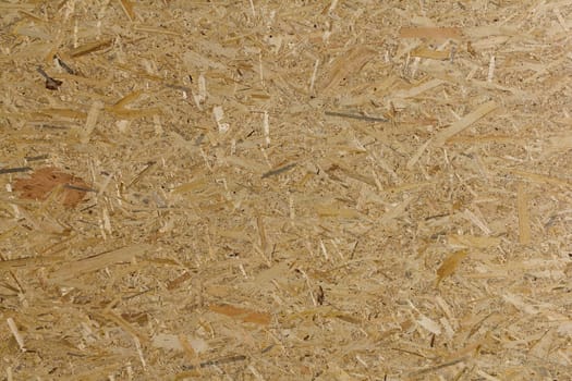 Pressed wooden panel background seamless texture of oriented strand board - OSB