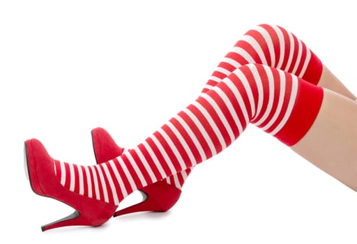 Sexy Santa woman legs isolated on white background