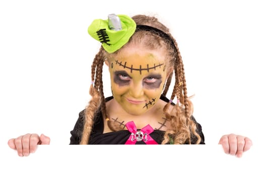 Girl with face-paint and Halloween monster costume over a white board