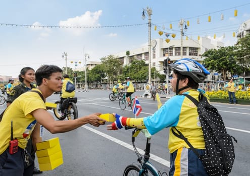 BANGKOK, THAILAND - DECEMBER 11, 2015 : "Bike for Dad"", Thai event to pay respect to King Bhumibol on his 88 th birthday celebration by participant cycling along the city road in Bangkok, Thailand"