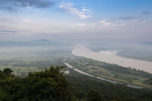 Aerial landscape view of Mekong river with mountain ranges with morning mist in Nong Khai Province, Thailand
