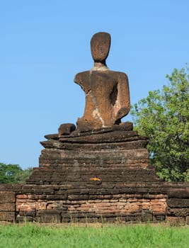 Ancient and ruins Buddha statue in Kamphaeng Phet Historical Park, Thailand