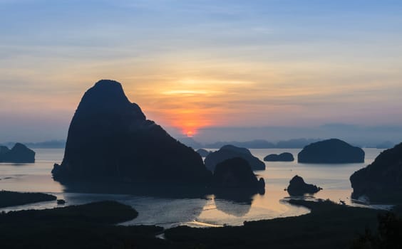 Landscape of limestone karsts in Phang nga bay at sunrise. Unseen place of "Samed Nangshe"" or ""Samet Nangchee"" in Phang Nga province, Thailand."