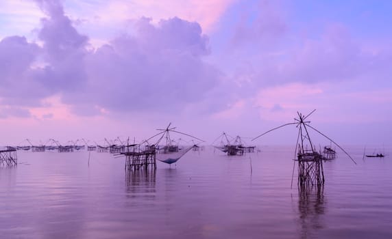 Beautiful sunrise seascape with Chinese fishing nets or shore operated lift nets in Phatthalung, Thailand