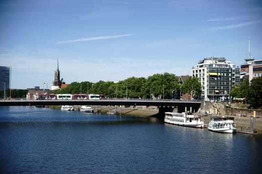 The view over the river Weser and the city of Bremen with buildings and infrastructure.