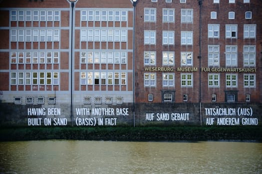 Bremen,Germany - August 30,2016: The façade of the Weserburg Museum,a brick building on the banks of the Weser river,on August 30,2016 in Bremen.