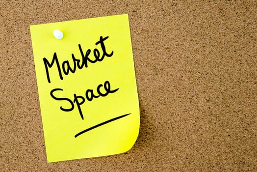 Market Space text written on yellow paper note pinned on cork board with white thumbtack. Business concept image with copy space available
