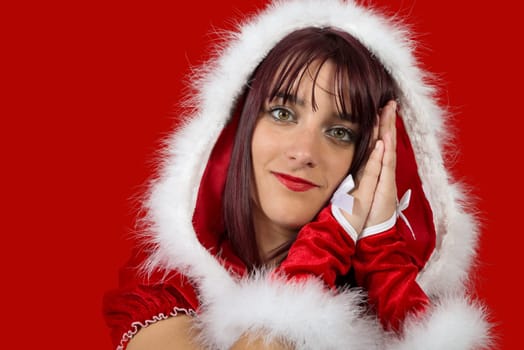 christmas. portrait of beautiful  girl wearing santa claus clothes