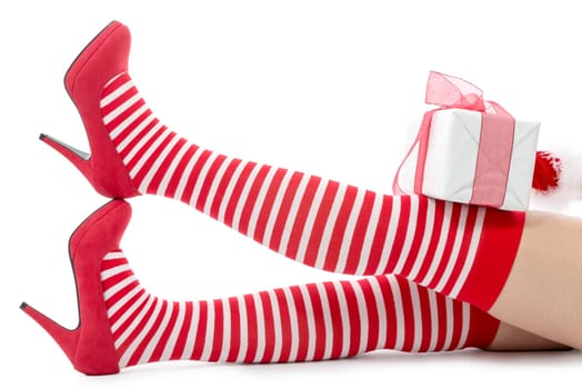 Sexy Santa woman legs isolated on white background
