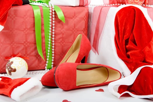 the red and white Christmas gift boxes with woman shoes