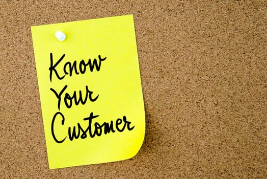 Know Your Customer text written on yellow paper note pinned on cork board with white thumbtack. Business concept image with copy space available