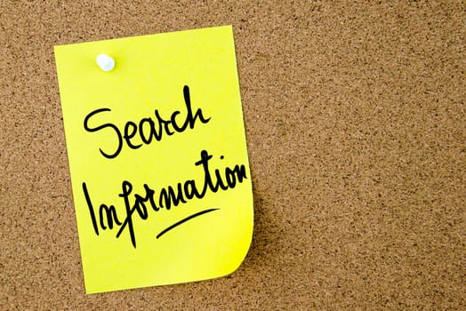 Search Information text written on yellow paper note pinned on cork board with white thumbtack. Business concept image with copy space available