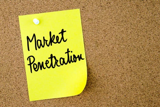 Market Penetration text written on yellow paper note pinned on cork board with white thumbtack. Business concept image with copy space available