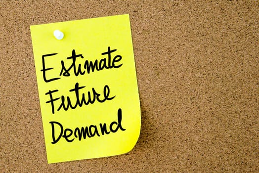 Estimate Future Demand text written on yellow paper note pinned on cork board with white thumbtack. Business concept image with copy space available