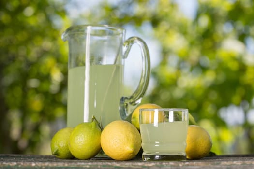 lemon juice on a wooden table, summer set, outdoor