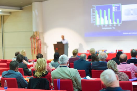 Speaker Giving a Talk at Business Meeting. Audience in the Conference Hall. Business and Entrepreneurship.