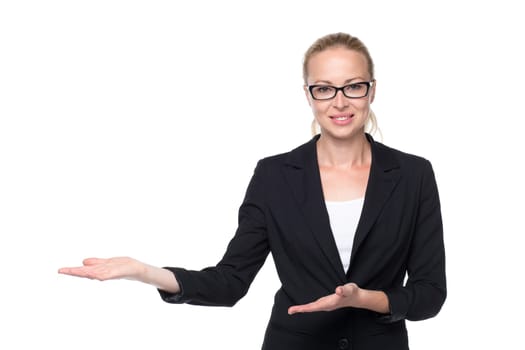 Beautiful young businesswoman smiling, holding open palm with empty copy space. Business woman showing hand sign to side, concept of advertisement product. White background.