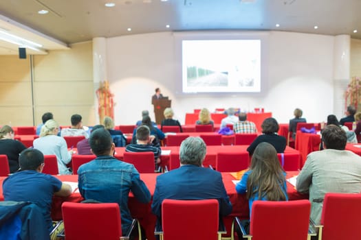 Speaker Giving a Talk at Business Meeting. Audience in the Conference Hall. Business and Entrepreneurship.