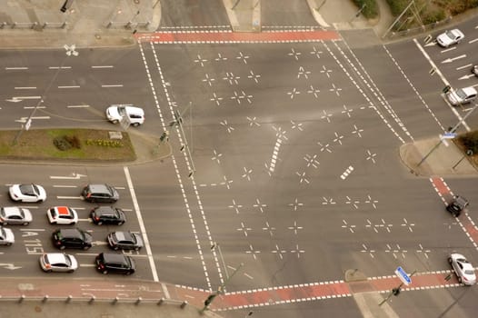 The top view and aerial view of a multi-lane road with road traffic.