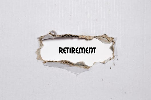 The word retirement appearing behind torn paper