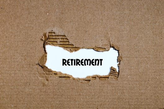 The word retirement appearing behind torn paper