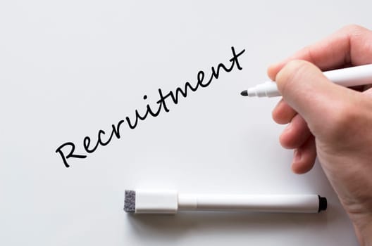 Human hand writing recruitment on whiteboard