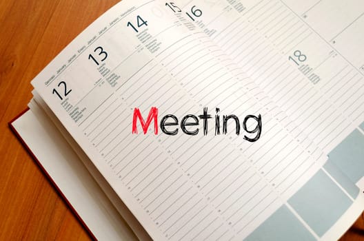 Meeting text concept write on notebook