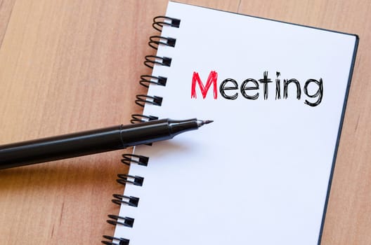 Meeting text concept write on notebook