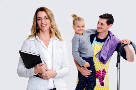 young beautiful businesswoman and her husband with child in background