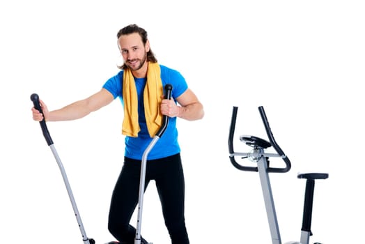 young man in blue shirt train with fitness machine and listening music
