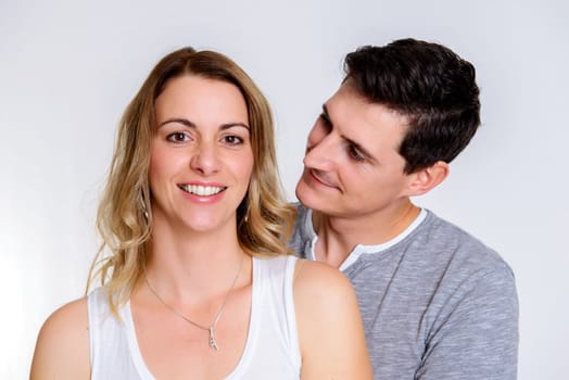 young beautiful couple in front of white background