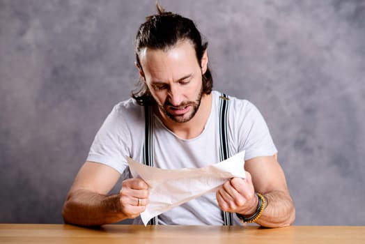 young man is annoyed about a letter