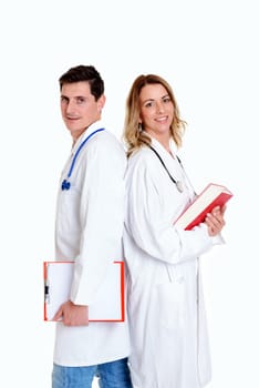 young friendly medical team with book in lab coat in front of white background
