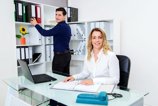 young businessman and businesswoman working together in the office
