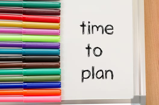 Felt-tip pen and whiteboard on a wooden background and time to plan text concept