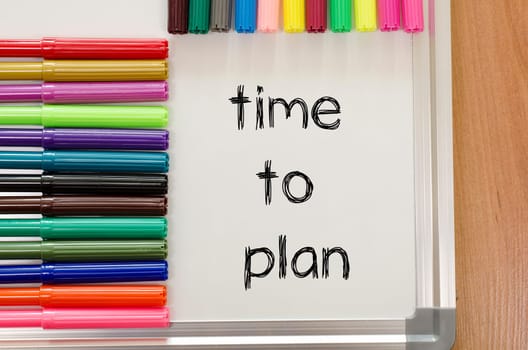 Felt-tip pen and whiteboard on a wooden background and time to plan text concept