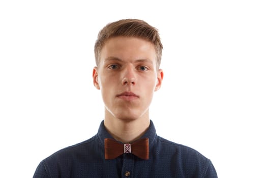 A man wearing a blue shirt and a wooden bowtie