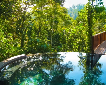 Bali, Indonesia - April 14, 2014: View of swimming pool at Nandini Bali Jungle Resort and Spa.