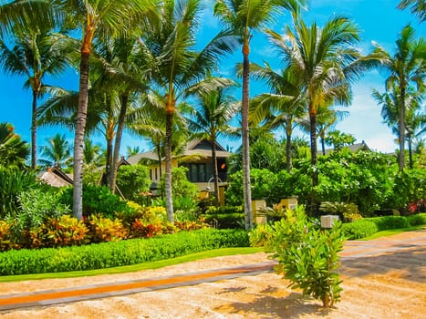 Nusa Dua, Bali, Indonesia - April 14, 2014: View of the cottages at the beach at St. Regis Bali Resort
